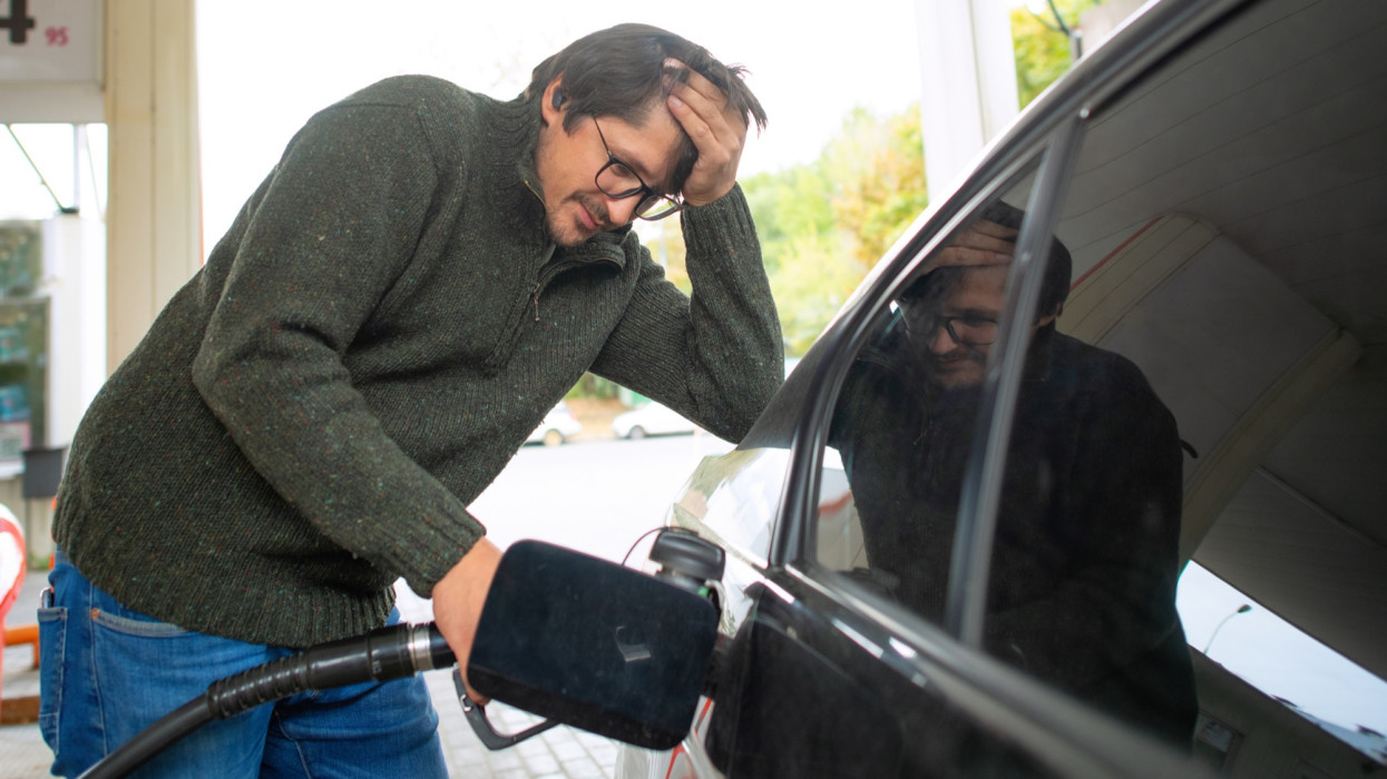 Man displeased and worried about fuel prices. Energy crisis concept,